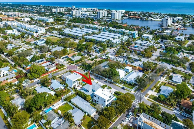 birds eye view of property with a water view