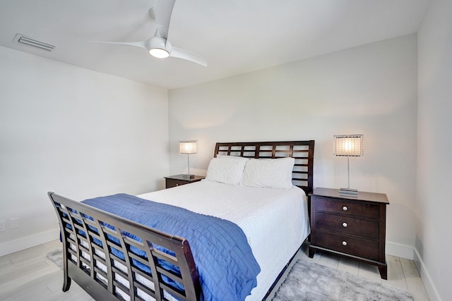 bedroom with ceiling fan and light wood-type flooring