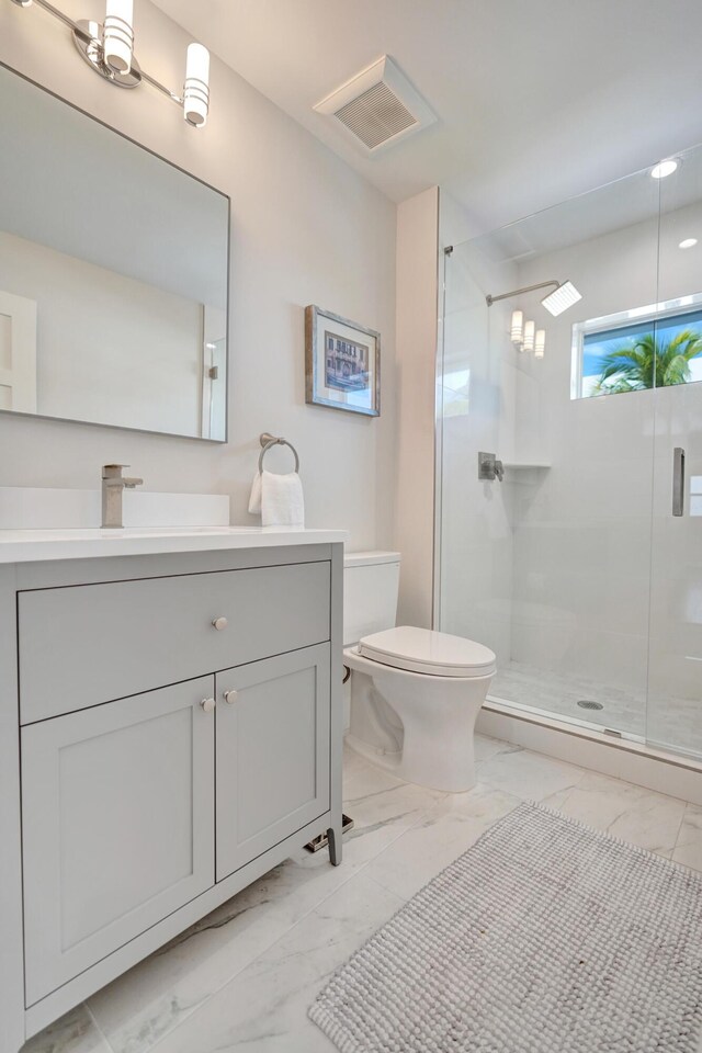 kitchen featuring white cabinetry and stainless steel refrigerator