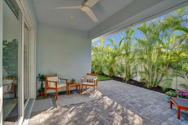 view of patio featuring ceiling fan