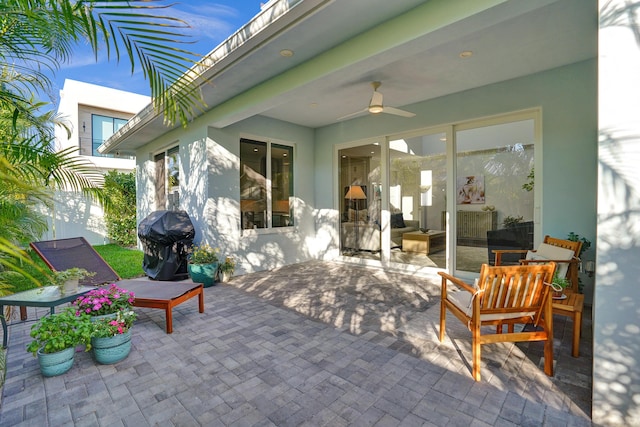 view of patio with grilling area and ceiling fan