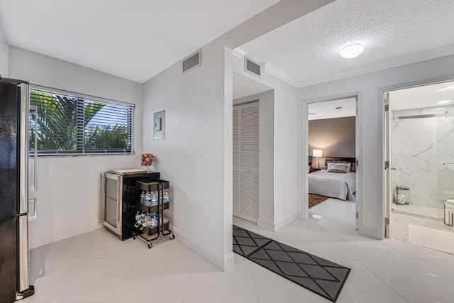 3605 S Ocean Blvd Unit 312, South Palm Beach, FL 33480 - interior space featuring baseboards, visible vents, and a textured ceiling