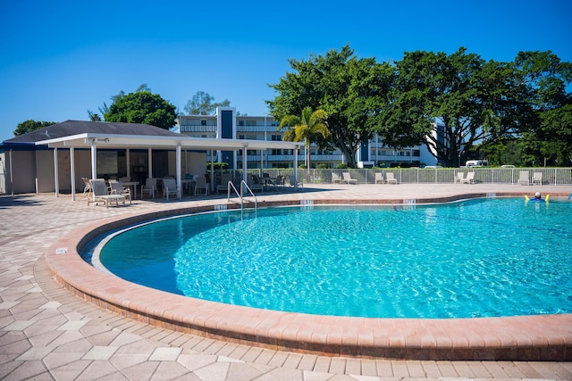 view of pool featuring a patio