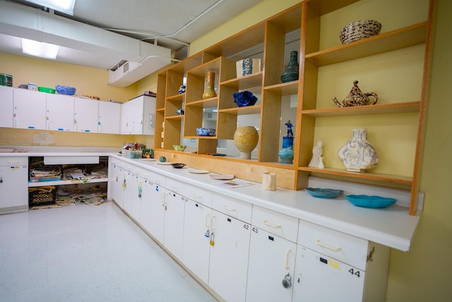 kitchen featuring white cabinets