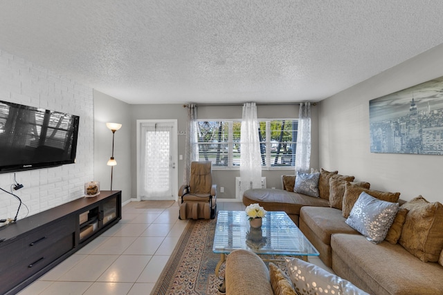 tiled living room featuring a textured ceiling