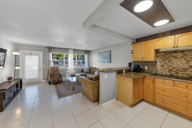 kitchen with dark stone countertops, black electric stovetop, light tile patterned floors, and decorative backsplash