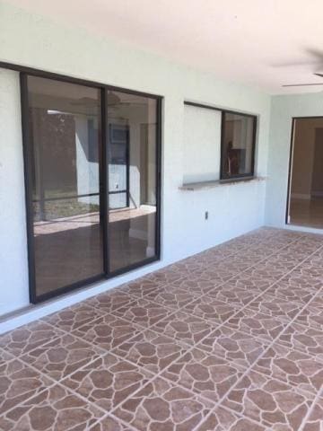 view of patio / terrace featuring ceiling fan