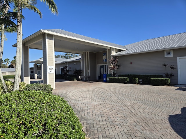 exterior space with a carport