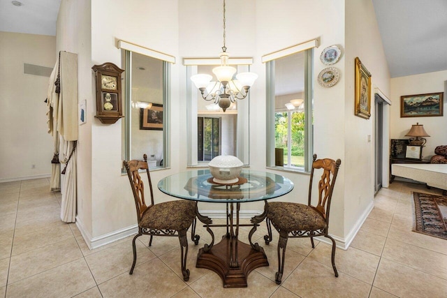 dining room featuring a chandelier, high vaulted ceiling, and light tile patterned floors