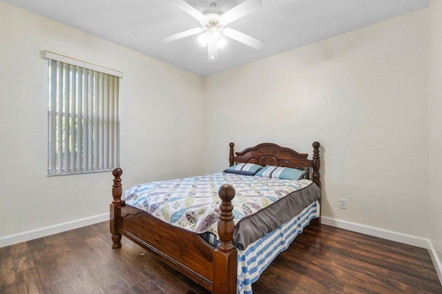 bedroom with ceiling fan and dark hardwood / wood-style flooring