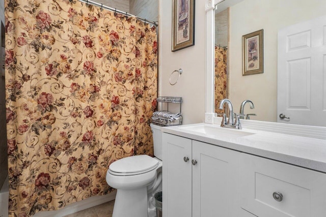 bathroom with a shower with curtain, vanity, tile patterned floors, and toilet