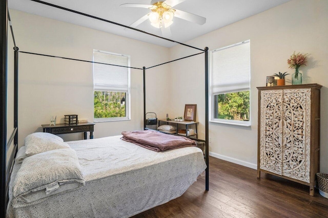 bedroom featuring dark wood-type flooring and ceiling fan