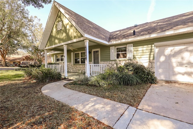 view of front of home with a porch and a garage