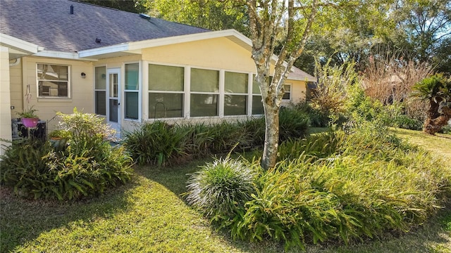 view of home's exterior featuring a yard