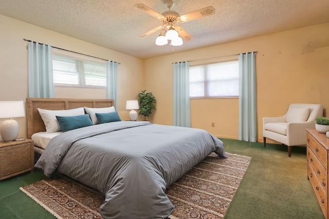 carpeted bedroom with multiple windows, ceiling fan, and a textured ceiling