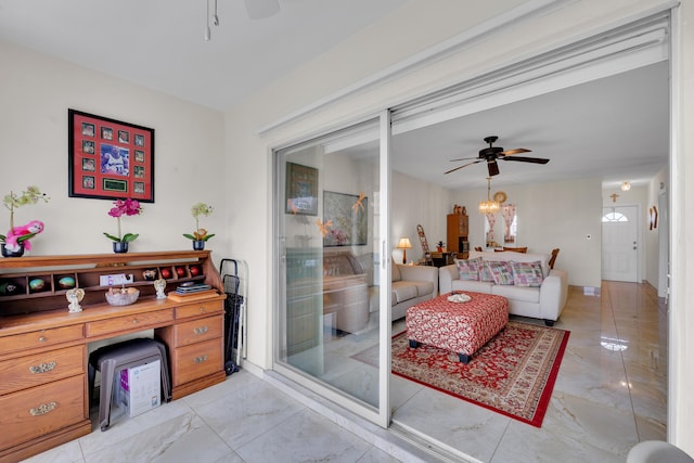 interior space featuring ceiling fan