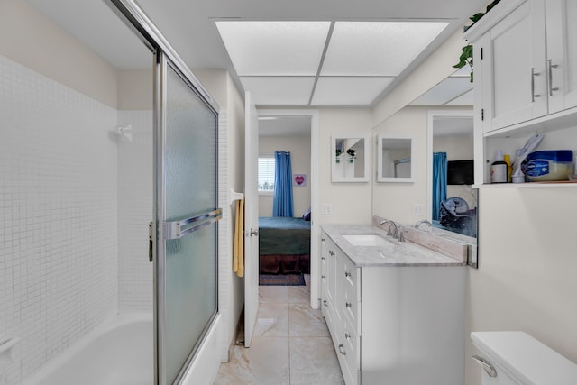 full bathroom with toilet, vanity, and shower / bath combination with glass door