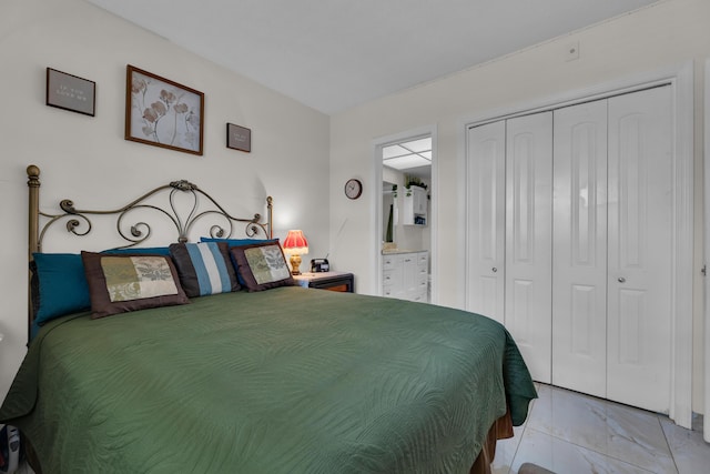 bedroom with a closet and ensuite bathroom