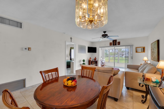 dining space featuring light tile patterned flooring and ceiling fan