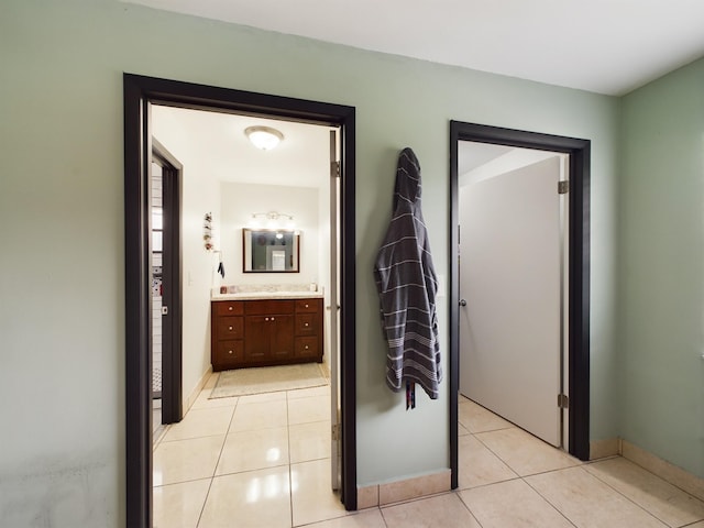 corridor featuring light tile patterned floors