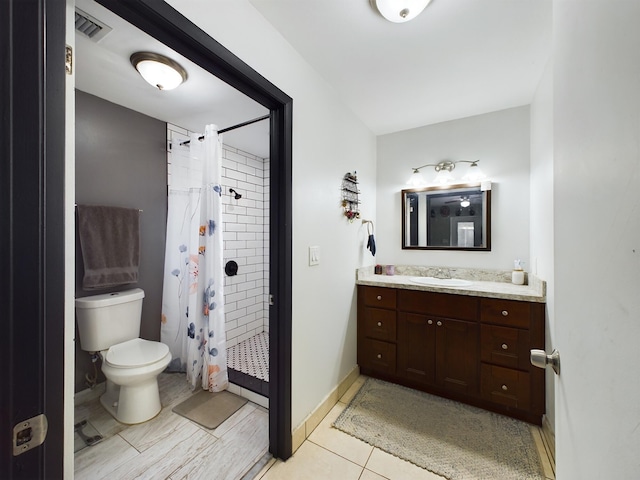 bathroom with a shower with curtain, tile patterned floors, vanity, and toilet