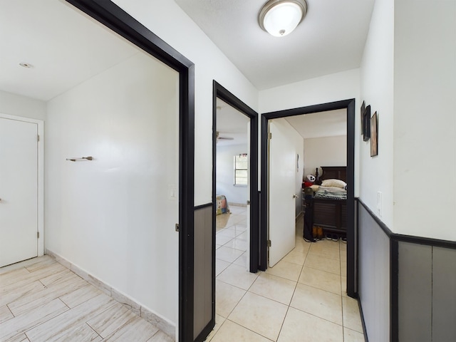 hallway with light tile patterned flooring