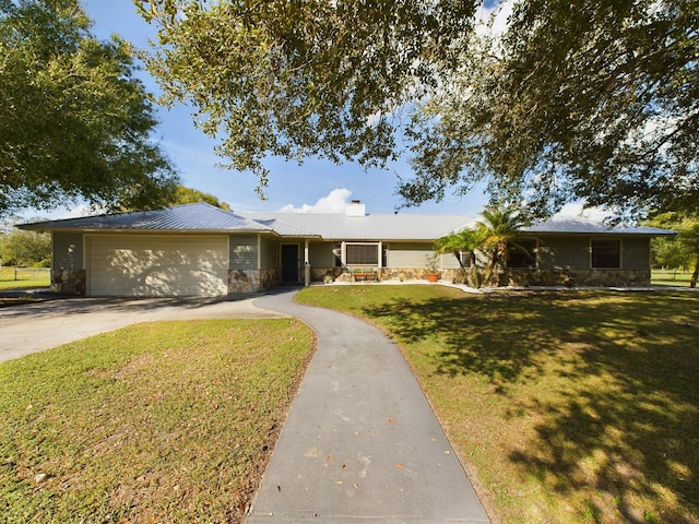 ranch-style home with a garage and a front lawn