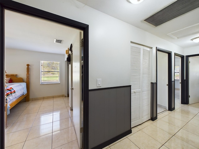 hallway with light tile patterned flooring