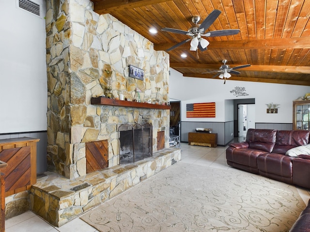 living room featuring light tile patterned floors, a fireplace, lofted ceiling with beams, and wooden ceiling