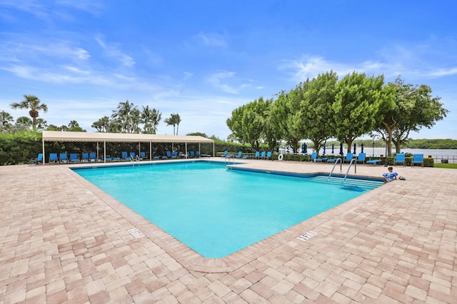 community pool featuring a patio area