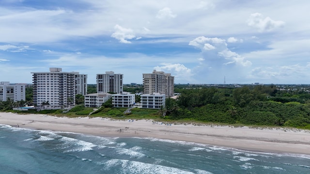 aerial view with a city view, a beach view, and a water view