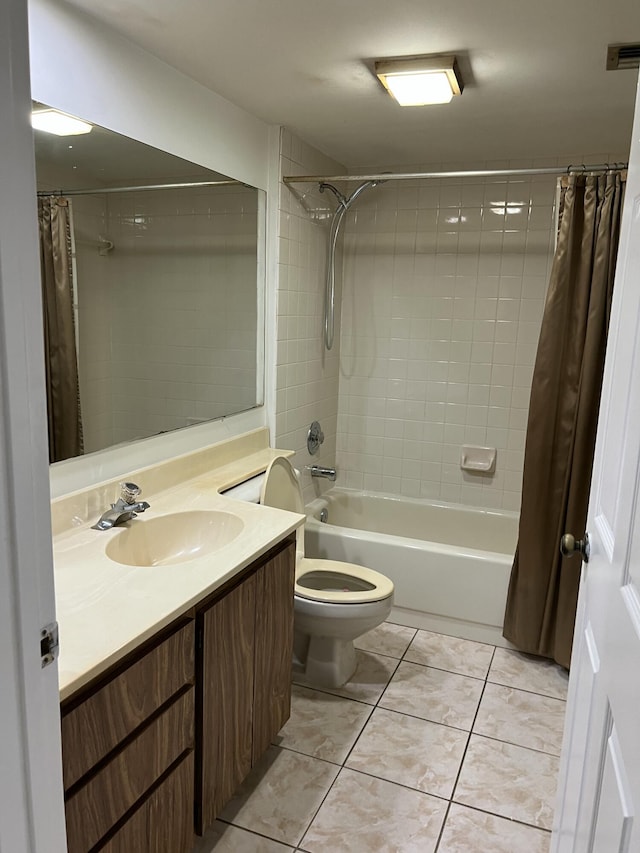 full bathroom featuring vanity, shower / tub combo with curtain, tile patterned floors, and toilet