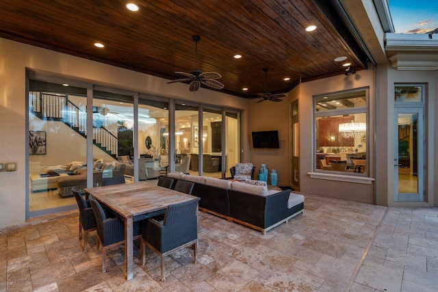 view of patio featuring outdoor lounge area and ceiling fan