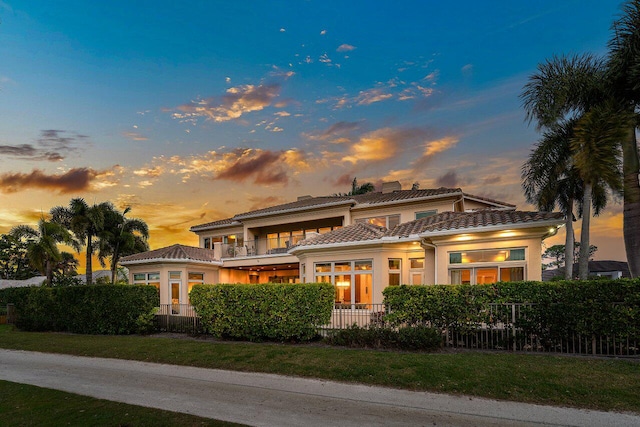 view of front of home with a balcony