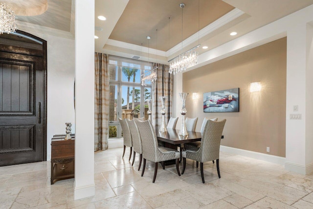 dining area featuring crown molding and a raised ceiling