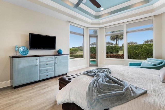 bedroom featuring crown molding, ceiling fan, light hardwood / wood-style floors, access to outside, and a raised ceiling