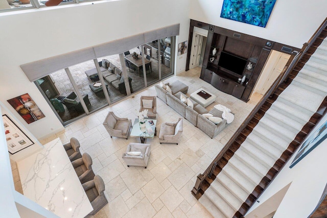 living room with a towering ceiling