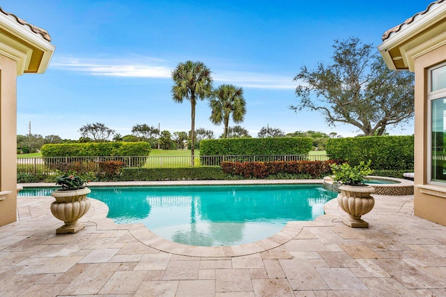 view of pool featuring an in ground hot tub and a patio