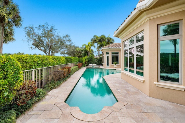 view of swimming pool with a patio