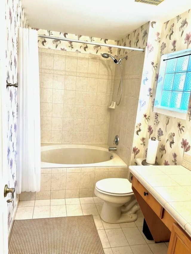6446 Willoughby Cir, Lake Worth, FL 33463 - full bath with toilet, tile patterned flooring, wallpapered walls, and tiled shower / bath combo