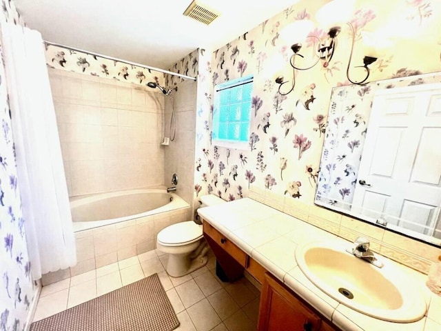 6446 Willoughby Cir, Lake Worth, FL 33463 - full bath with visible vents, toilet, vanity, tile patterned floors, and tiled shower / bath
