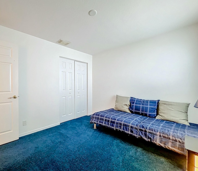 sitting room featuring dark carpet