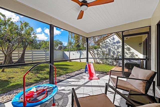 sunroom / solarium with ceiling fan