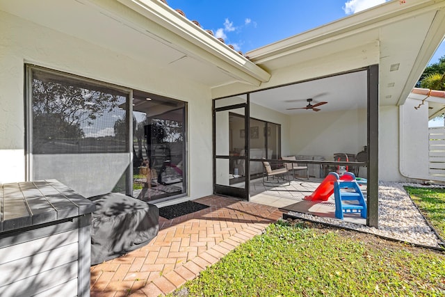 view of patio / terrace featuring ceiling fan