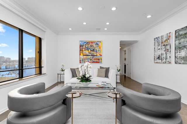 living room with crown molding and hardwood / wood-style floors