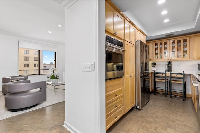 kitchen featuring light parquet flooring and stainless steel appliances