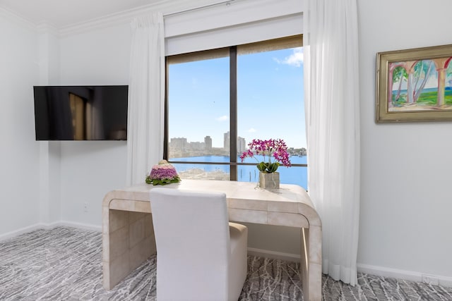 dining space featuring crown molding and carpet flooring