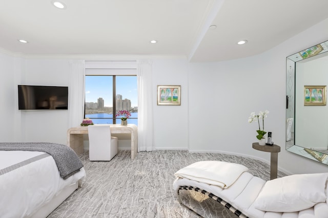 bedroom featuring light colored carpet and ornamental molding