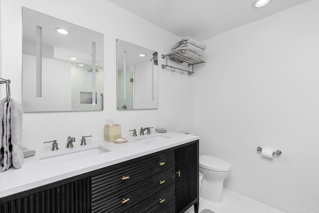 bathroom featuring vanity, tile patterned flooring, a shower, and toilet