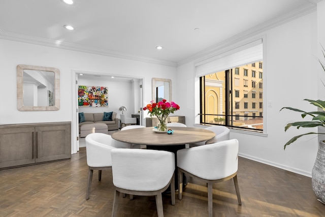 dining area featuring crown molding and dark parquet floors